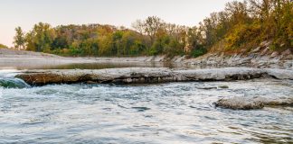 Photo by Rick Pepper - Looking south onto the Blue Earth River, notice the wood structure under concrete