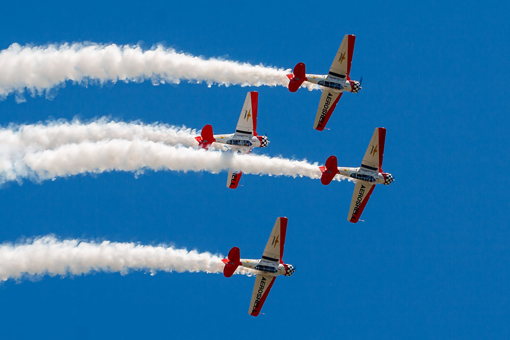 Photo by Rick Pepper - 2012 Mankato Air Show - The Shell Aerobatic team perfomring a loop