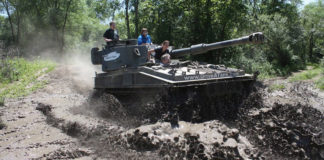 Photo courtesy of Drive A Tank - FV433 Abbot driving through the mud