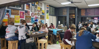 Submitted Photo - Participants at work at Design & Wine's space on Belgrade Avenue in North Mankato