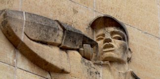 Photo by Mike Lagerquist - Detail of the Lineman on the Consolidated Communications building in Mankato