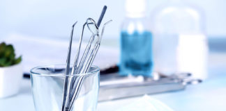 Dentist tools in glass table close up